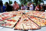 Pizza-building contest from 2019 Pizzafest. The event returns to Veterans Park on April 22, 23, 24.